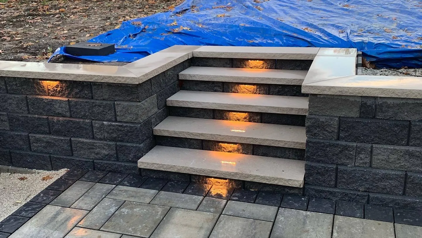 In progress: lighted block steps between two walls, with a blue tarp still covering the level above